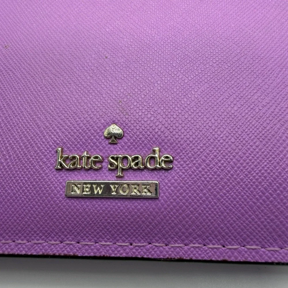 Kate Spade New York purple leather wristlet.